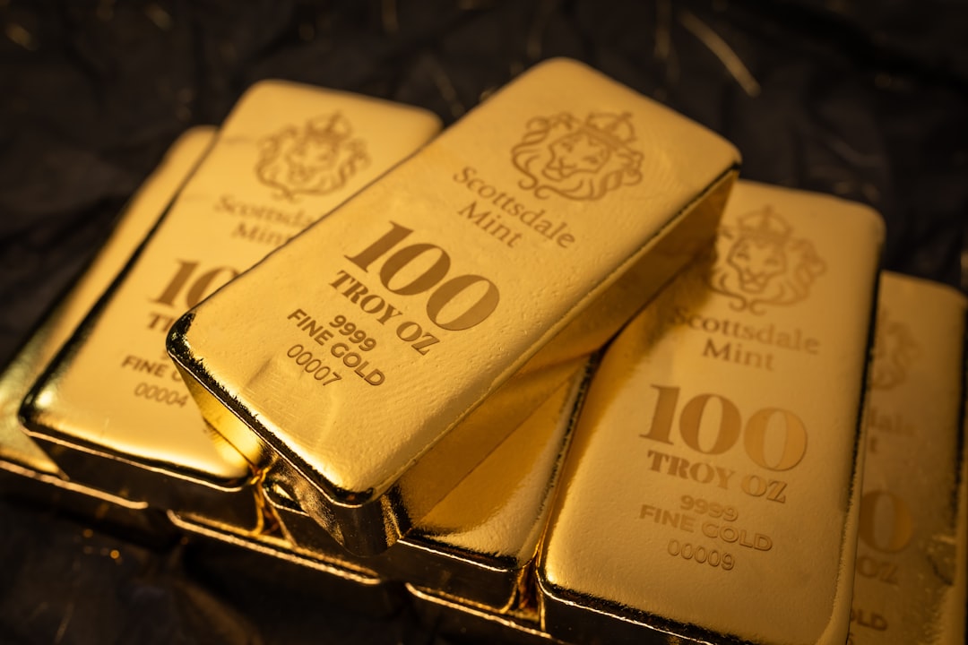 Beautiful 100 Troy Ounce Gold Bullion Bar by Scottsdale Mint sitting on a dark background. Please give a shoutout to Scottsdale Mint if able! Shop online for the most beautiful bullion at ScottsdaleMint.com!
